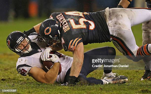 Brian Urlacher of the Chicago Bears hits Garrett Graham of the Houston Texans at Soldier Field on November 11, 2012 in Chicago, Illinois. The Texans...