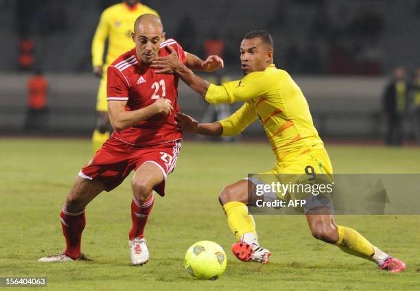 Morocco's Nordin Amrabet vies with Togo's Thomas Dossevi during the freindly match Morocco vs Togo in Casablanca on November 14, 2012 .AFP / PHOTO...