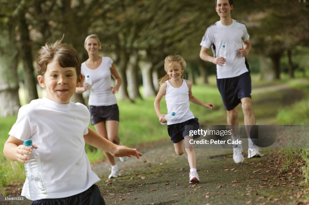 Family jogging in park