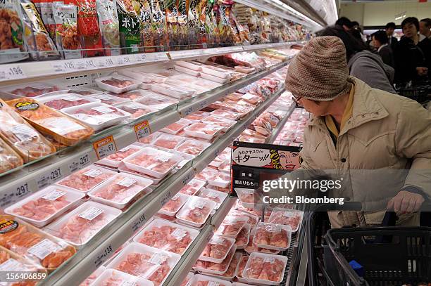 Customers browse packaged meat in a Seiyu GK supermarket in Tokyo, Japan, on Wednesday, Nov. 14, 2012. Seiyu GK is a unit of Wal-Mart Stores Inc....
