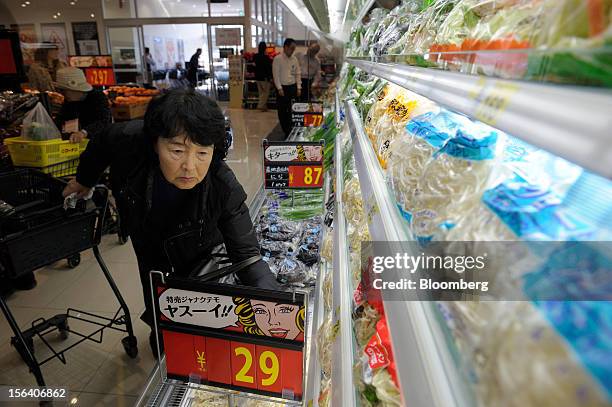 Customer browses vegetables in a Seiyu GK supermarket in Tokyo, Japan, on Wednesday, Nov. 14, 2012. Seiyu GK is a unit of Wal-Mart Stores Inc....