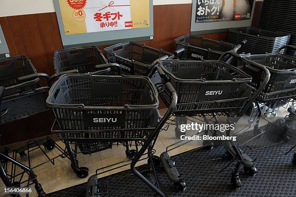 The Seiyu GK logo is displayed on shopping carts in the company's supermarket in Tokyo, Japan, on Wednesday, Nov. 14, 2012. Seiyu GK is a unit of...