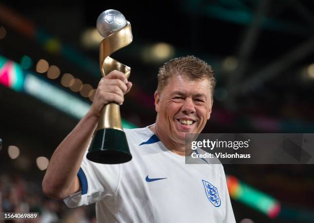 Smiling England fan holding a replica of the FIFA Women's World Cup trophy during the FIFA Women's World Cup Australia & New Zealand 2023 Group D...