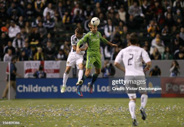 Adam Johansson of the Seattle Sounders wins a high ball from Mike Magee of the Los Angeles Galaxy during Leg 1 of the Western Conference Championship...