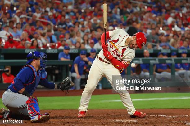 Willson Contreras of the St. Louis Cardinals is hit by a pitch in the eighth inning in the game against the Chicago Cubs at Busch Stadium on July 29,...