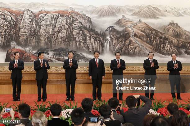 Zhang Gaoli, Liu Yunshan, Zhang Dejiang, Xi Jinping, Li Keqiang, Yu Zhengsheng and Wang Qishan greet the media at the Great Hall of the People on...