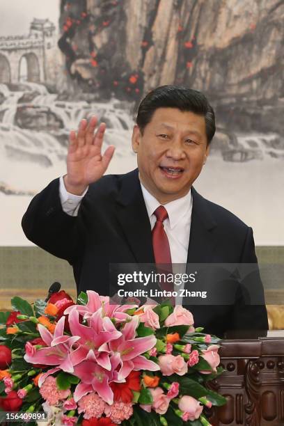 Chinese Vice President Xi Jinping, one of the members of new seven-seat Politburo Standing Committee, greets the media at the Great Hall of the...