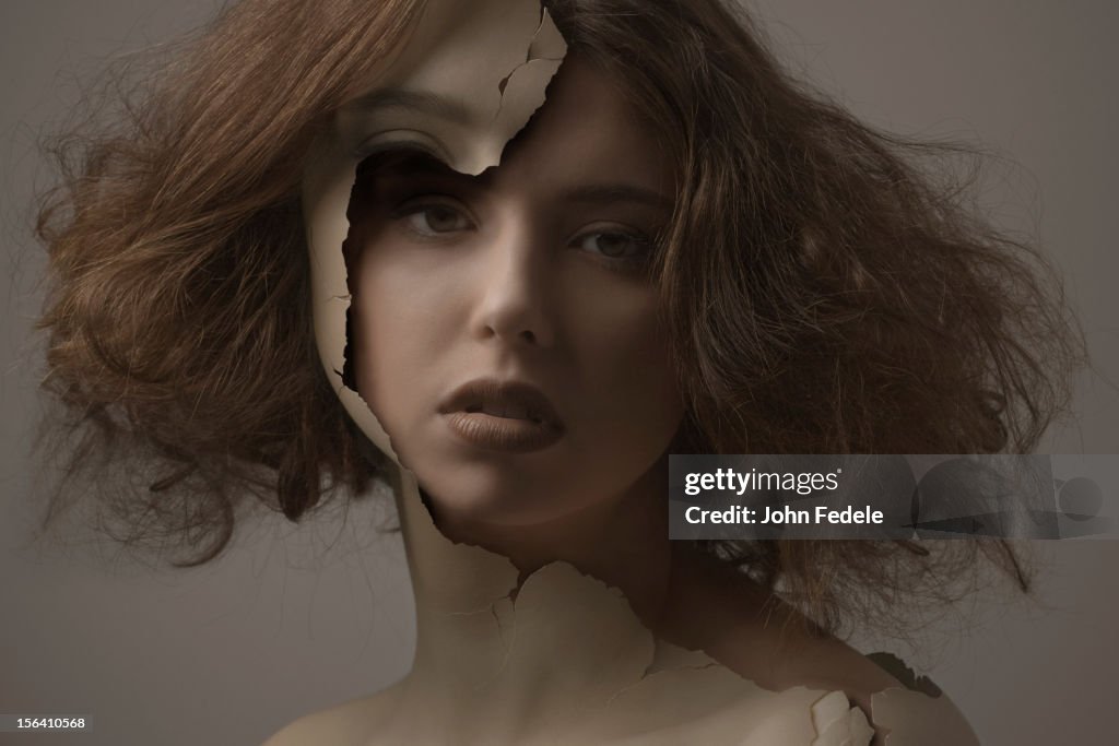 Caucasian woman with broken plastic skin