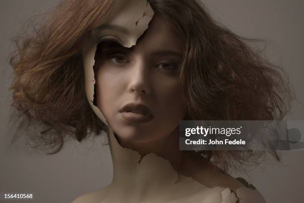 caucasian woman with broken plastic skin - break through concept stockfoto's en -beelden