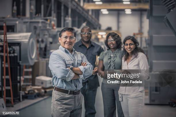 workers standing together in factory - diversity people engineering stock pictures, royalty-free photos & images