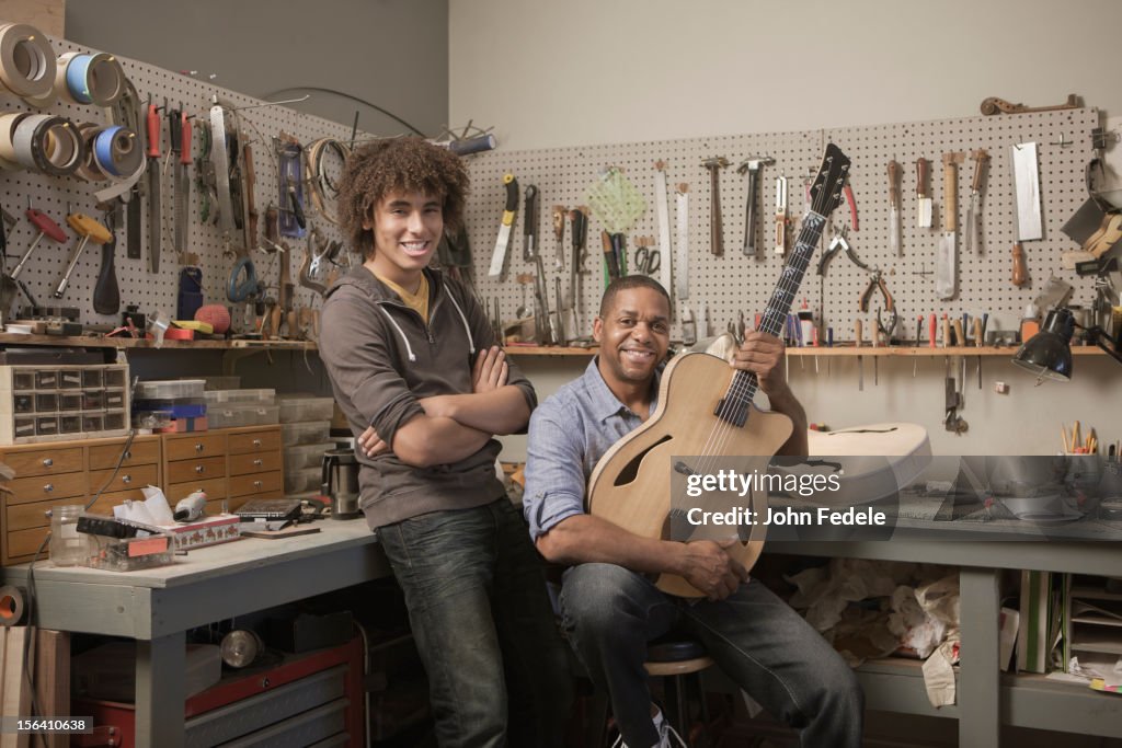 Father and son in music workshop