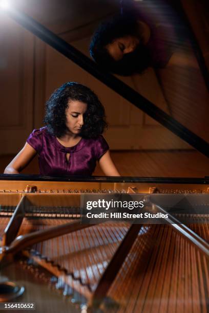 middle eastern woman playing piano - pianist front stock pictures, royalty-free photos & images