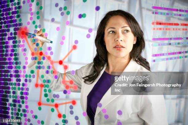 mixed race scientist working with scientific images - 女性科学者 ストックフォトと画像
