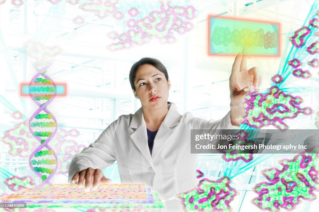 Mixed race scientist working with scientific images
