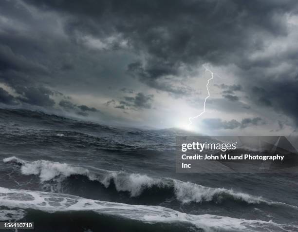 lightning striking ocean water - sea storm stock pictures, royalty-free photos & images