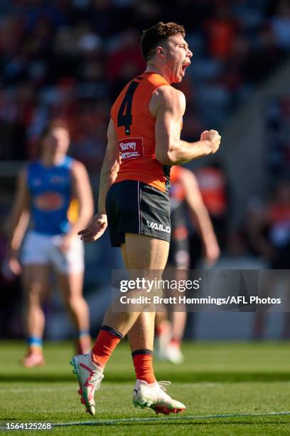 Toby Greene of the Giants celebrates kicking a goal during the round 19 AFL match between Greater Western Sydney Giants and Gold Coast Suns at Manuka...