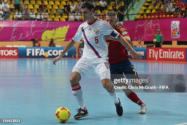 Sergey Sergeev of Russia keeps the ball from Miguelin of Spain during the FIFA Futsal World Cup, Quarter-Final match between Spain and Russia at...