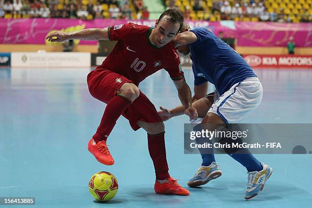 Ricardinho of Portugal contests the ball with Humberto Honorio of Italy during the FIFA Futsal World Cup, Quarter-Final match between Portugal and...