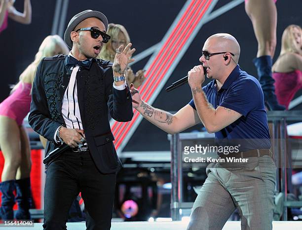 Singer Sensato and rapper Pitbull perform onstage during rehearsals for the 13th annual Latin GRAMMY Awards at the Mandalay Bay Events Center on...