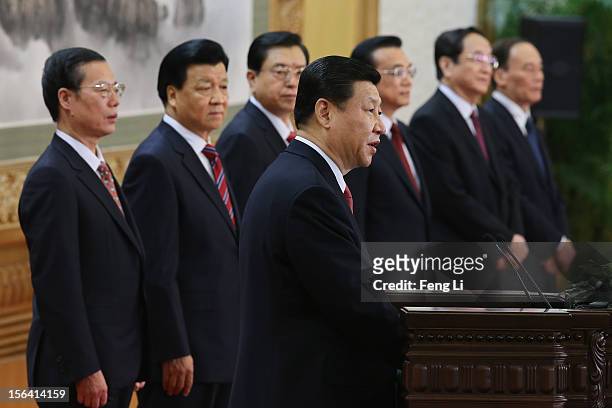 Chinese Vice President Xi Jinping , one of the members of new seven-seat Politburo Standing Committee, delivers a speech as Zhang Gaoli, Liu Yunshan,...