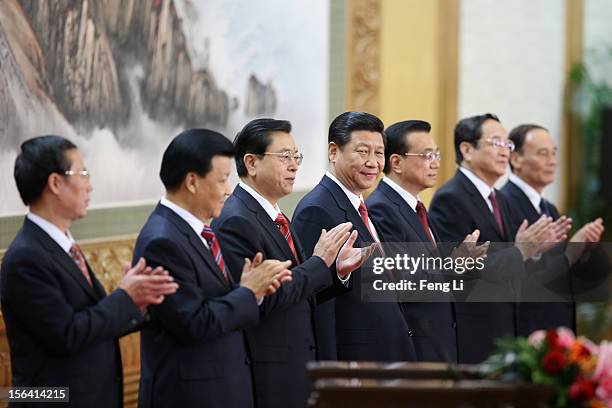 Zhang Gaoli, Liu Yunshan, Zhang Dejiang, Xi Jinping, Li Keqiang, Yu Zhengsheng and Wang Qishan greet the media at the Great Hall of the People on...