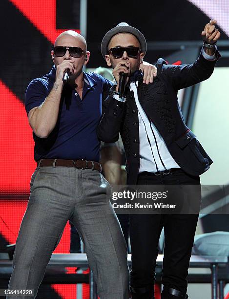 Rapper Pitbull and singer Sensato perform onstage during rehearsals for the 13th annual Latin GRAMMY Awards at the Mandalay Bay Events Center on...