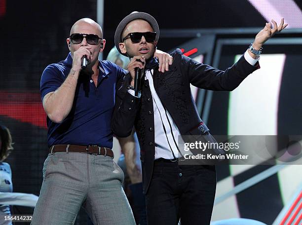 Rapper Pitbull and singer Sensato perform onstage during rehearsals for the 13th annual Latin GRAMMY Awards at the Mandalay Bay Events Center on...