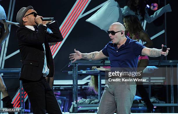 Singer Sensato and rapper Pitbull perform onstage during rehearsals for the 13th annual Latin GRAMMY Awards at the Mandalay Bay Events Center on...