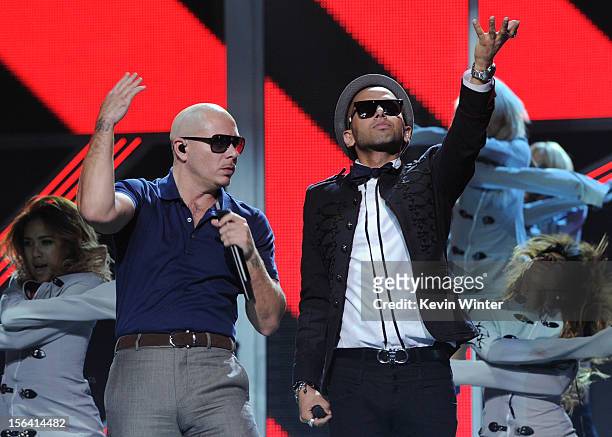 Rapper Pitbull and singer Sensato perform onstage during rehearsals for the 13th annual Latin GRAMMY Awards at the Mandalay Bay Events Center on...
