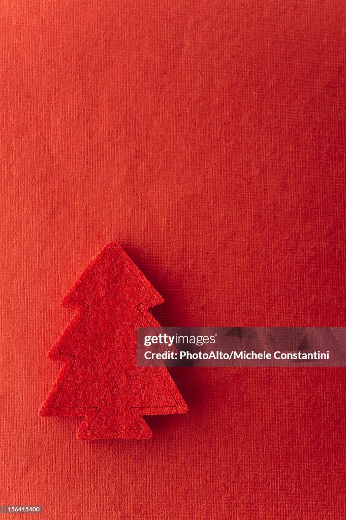 Christmas tree shape on red background