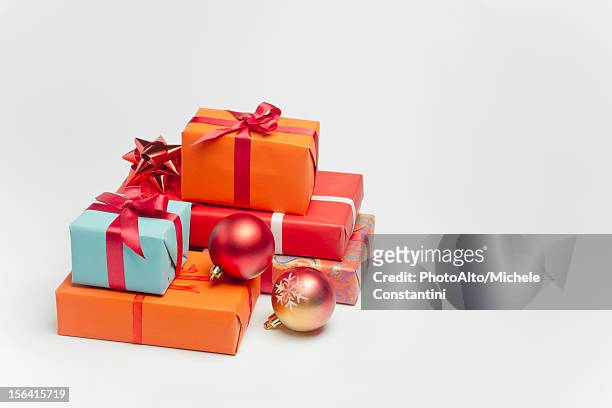 festively wrapped christmas gifts - pile of gifts stock pictures, royalty-free photos & images