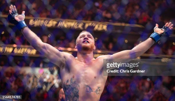Justin Gaethje celebrates beating Dustin Poirier during their BMF Title Lightweight fight at UFC 291 at the Delta Center July 29, 2023 at the in Salt...
