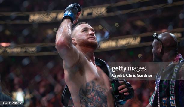 Justin Gaethje celebrates beating Dustin Poirier during their BMF Title Lightweight fight at UFC 291 at the Delta Center July 29, 2023 at the in Salt...