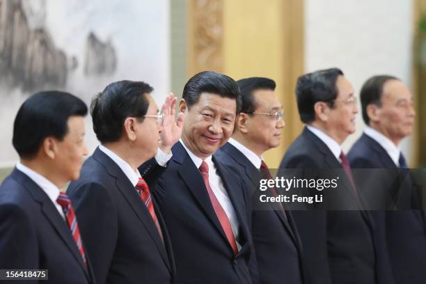 Liu Yunshan, Zhang Dejiang, Xi Jinping, Li Keqiang, Yu Zhengsheng and Wang Qishan greet the media at the Great Hall of the People on November 15,...