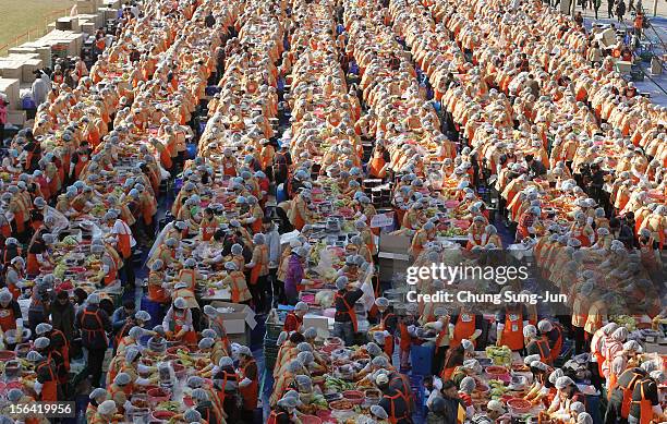 More than two thousand housewives make Kimchi for donation to the poor in preparation for winter in front of City Hall on November 15, 2012 in Seoul,...