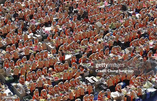 More than two thousand housewives make Kimchi for donation to the poor in preparation for winter in front of City Hall on November 15, 2012 in Seoul,...