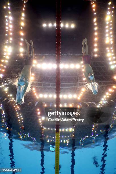 Chase Kalisz of Team United States and Leon Marchand of Team France compete in the Men's 400m Medley Heats on day one of the Fukuoka 2023 World...