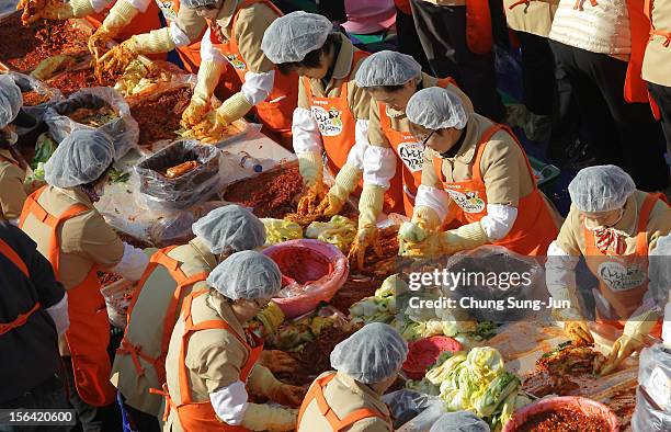 More than two thousands of housewives make Kimchi for donation to the poor in preparation for winter in front of City Hall on November 15, 2012 in...