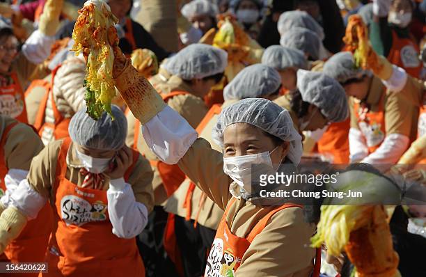 More than two thousands of housewives make Kimchi for donation to the poor in preparation for winter in front of City Hall on November 15, 2012 in...