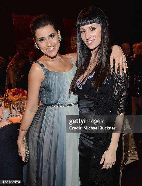 Singers Nelly Furtado and Mala Rodriguez pose during the 2012 Person of the Year honoring Caetano Veloso at the MGM Grand Garden Arena on November...