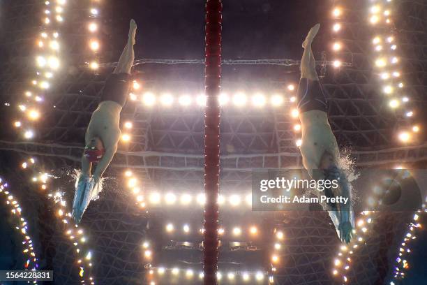 Lewis Edward Burras of Team Great Britain and Alessandro Miressi of Team Italy compete in the Men's 4x100m Freestyle Heats on day one of the Fukuoka...