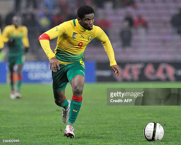 Cameroonian captain player Samuel Etoo runs with the ball during a friendly football match Albania vs Cameroon on November 14, 2012 in Geneva. AFP...