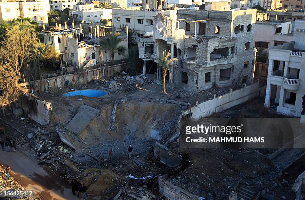 General view shows a crater at a sport targeted by an Israeli air strike in Gaza City in the early hours of November 15, 2012. Israel killed on...