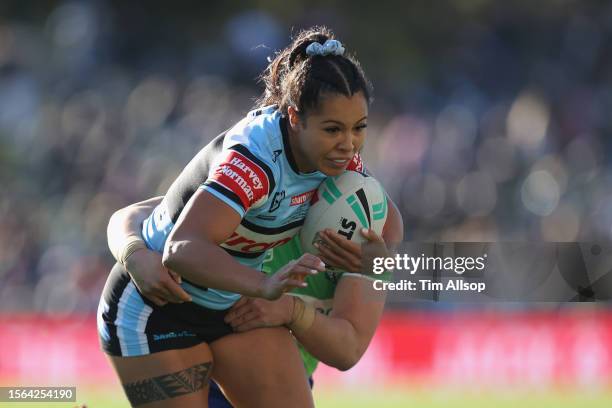 Tiana Penitani of the Cronulla Sharks is tackled during the round one NRLW match between Cronulla Sharks and Canberra Raiders at PointsBet Stadium,...