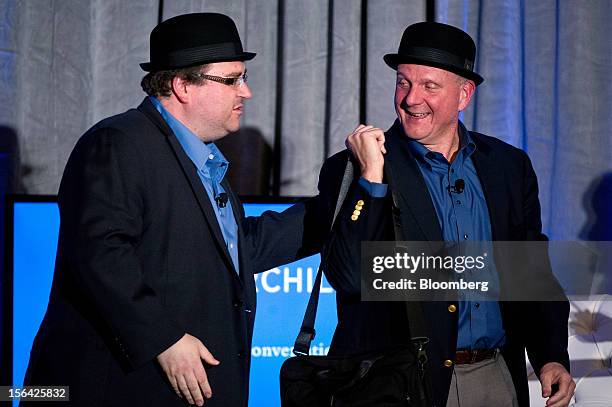 Reid Hoffman, chairman and co-founder of LinkedIn Corp., left, and Steve Ballmer, chief executive officer of Microsoft Corp., leave the stage wearing...