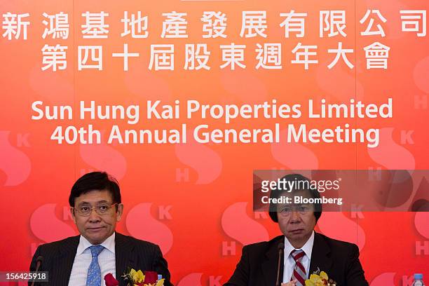 Raymond Kwok, co-chairman of Sun Hung Kai Properties Ltd., left, sits with Thomas Kwok, co-chairman, during a news conference in Hong Kong, China, on...