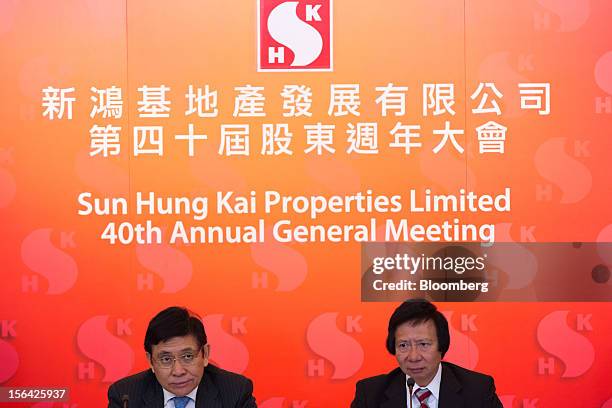 Raymond Kwok, co-chairman of Sun Hung Kai Properties Ltd., left, sits with Thomas Kwok, co-chairman, during a news conference in Hong Kong, China, on...