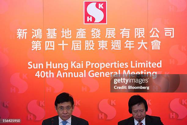 Raymond Kwok, co-chairman of Sun Hung Kai Properties Ltd., left, sits with Thomas Kwok, co-chairman, during a news conference in Hong Kong, China, on...