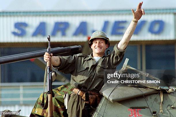 Serb soldier waves as leaving the Sarajevo airport on June 29, 1992 after an agreement was reached to hand the airport over to the United Nations...