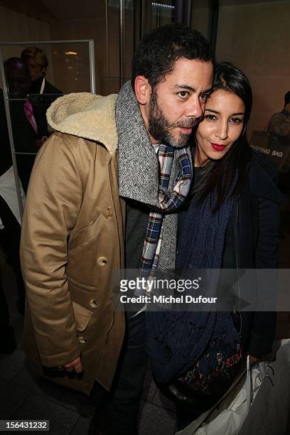Manu Payet and Leila Bekhti attend the Maison Martin Margiela With H&M Collection Launch at H&M Champs Elysees on November 14, 2012 in Paris, France.